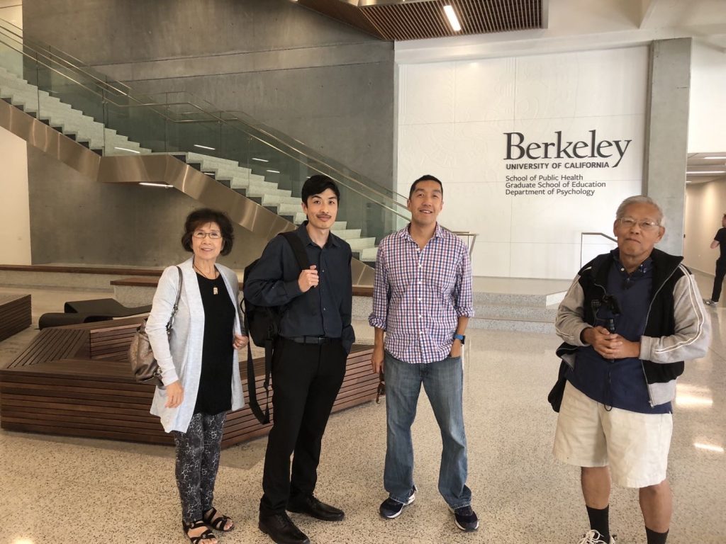 Nora with middle son, eldest son and husband