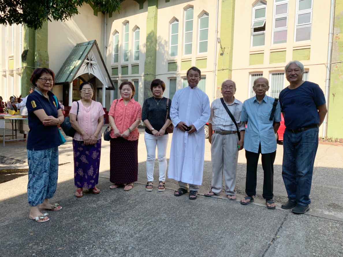 Martha Lu (2nd from left) and her brother Kar Site Lu (3rd from right) with family outside St. Theresa's Church, mid-2019
