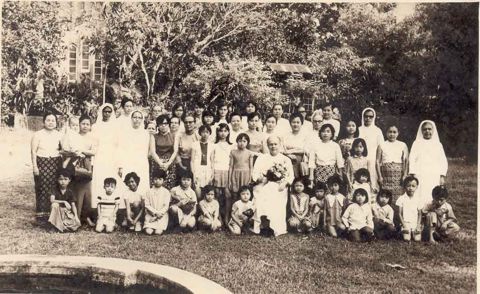 Father Danis with well-wishers