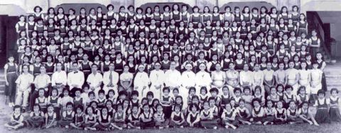 Administrators, teachers, and girl students in the 1950s