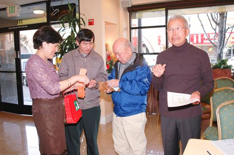 Joseph Lye buying raffle tickets