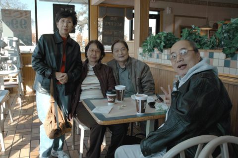 Alumni resting at a rest stop