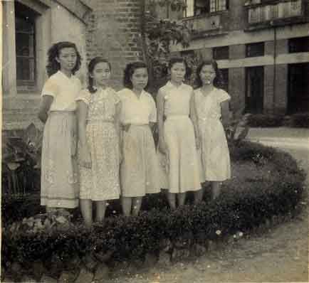 Maisie with friends in front of the church