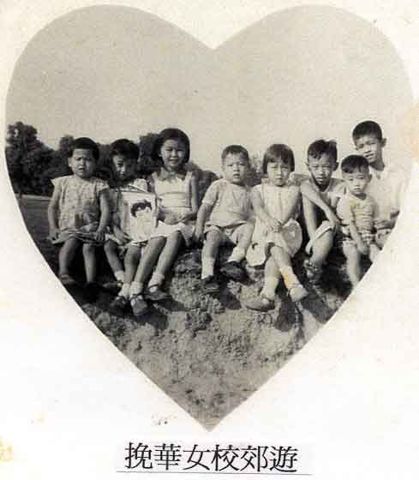 Teachers' children posed for a picture at a picnic